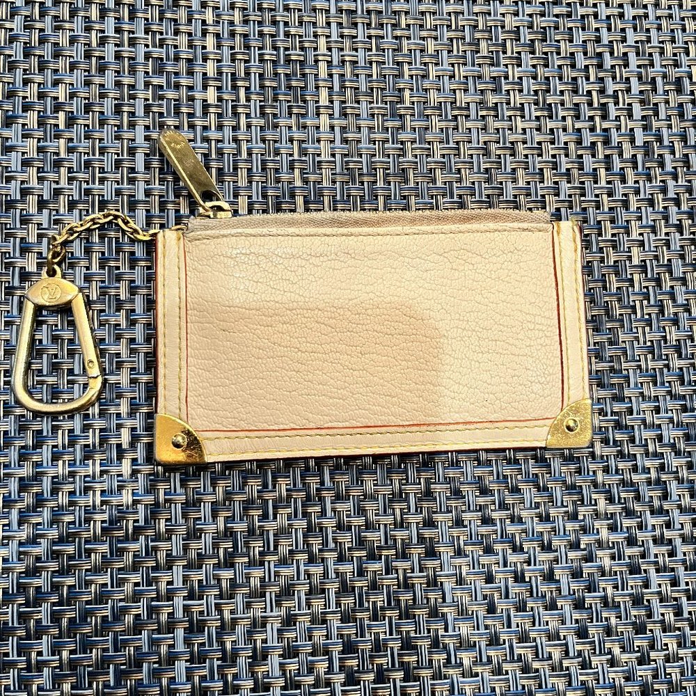 Authentic Louis Vuitton White Suhali Poche Cles